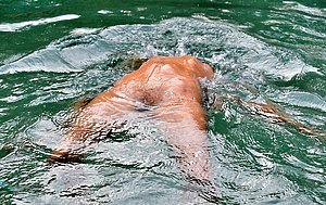 Young blonde enjoys skinny dipping after passionate masturbation