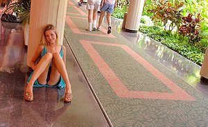 Dress-wearing blonde shows her feet and tits in an erotic gallery