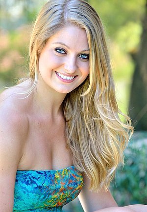 Big-breasted young beauty doing cartwheels while totally naked