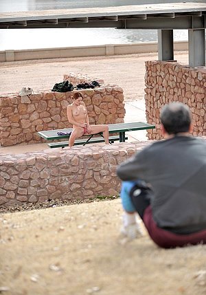 Upbeat nudist babe posing all over the place just to get you to care