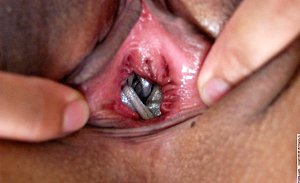 Fetishistic girl fucking her pussy with a high heeled shoe to orgasms