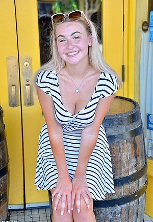 Naughty blonde with big naturals shamelessly posing in public